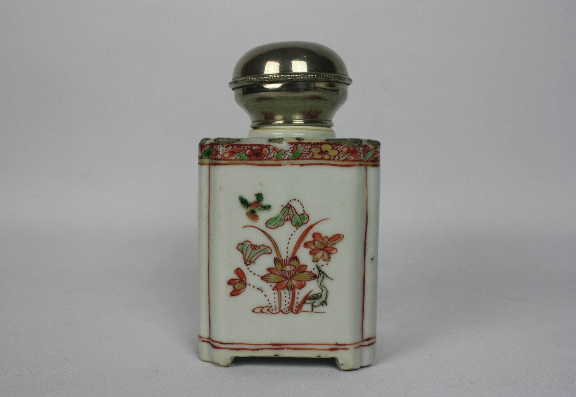 034 A Chinese porcelain tea caddy with silver lid